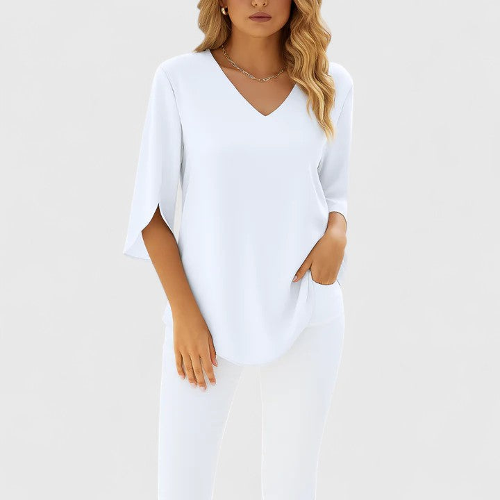 Women's sophisticated V-neck summer blouse. Elegant, versatile ladies' top with relaxed fit for casual chic.