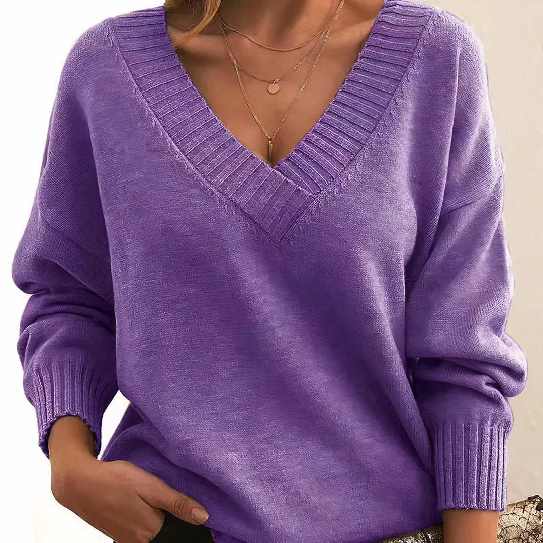Versatile women's V-neck cashmere sweater, elegant long-sleeve knit for comfortable fall & winter style.