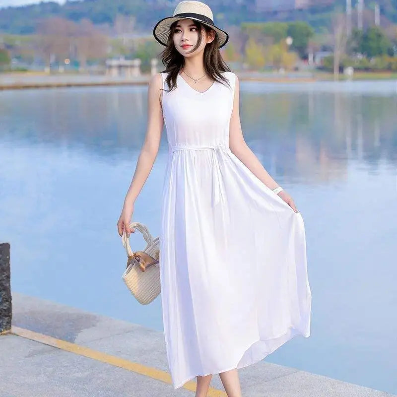 Women's elegant sleeveless V-neck maxi dress with a tie waist, flowy skirt & convenient side pockets.
