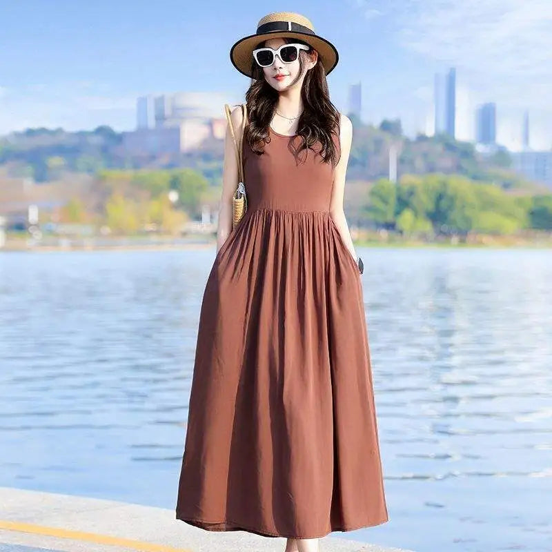 Casual summer sleeveless V-neck maxi dress with comfy tie waist and practical side pockets.