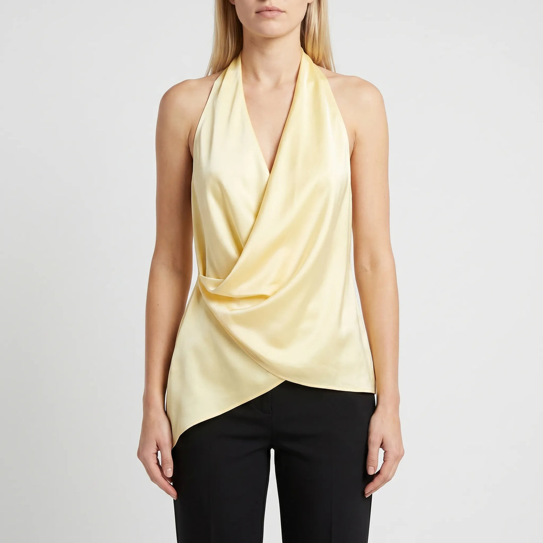 Chic women's sleeveless draped halter top with an asymmetrical hem, comfortable for summer fashion.