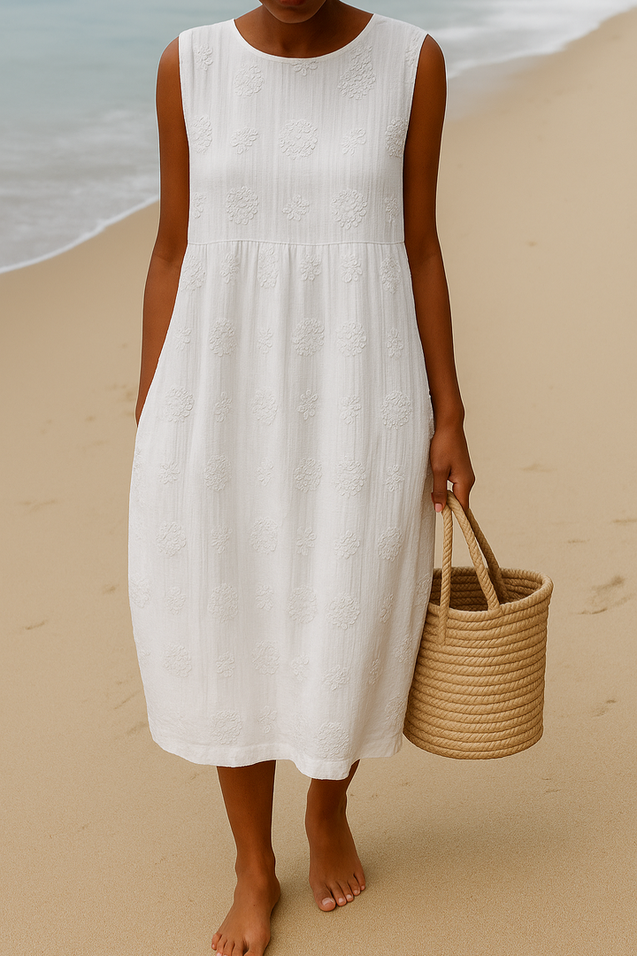 Elegant women's sleeveless midi dress featuring delicate embroidery and a flattering round neck design.