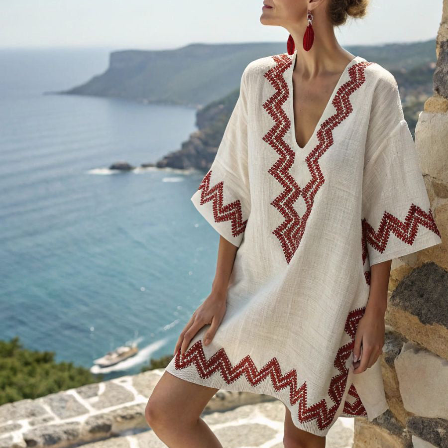 Women's embroidered tunic dress for beach holidays, featuring a loose fit and v-neck. Perfect for summer resort wear.