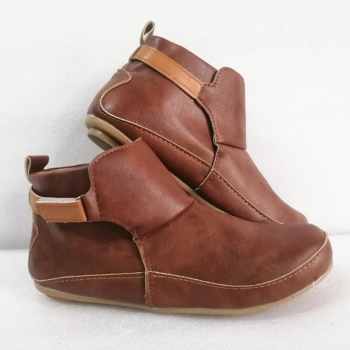 Modern women's ErgoFit slip-on ankle boots, blending comfort with contemporary style.