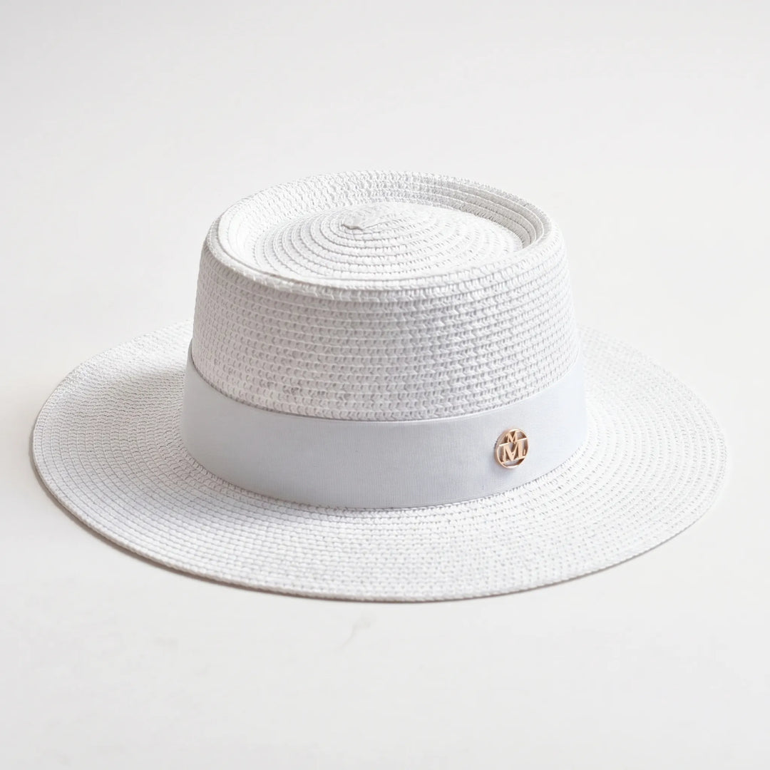 Women's summer flat top hat. Woven texture, wide brim, offers stylish sun protection for any outdoor adventure.
