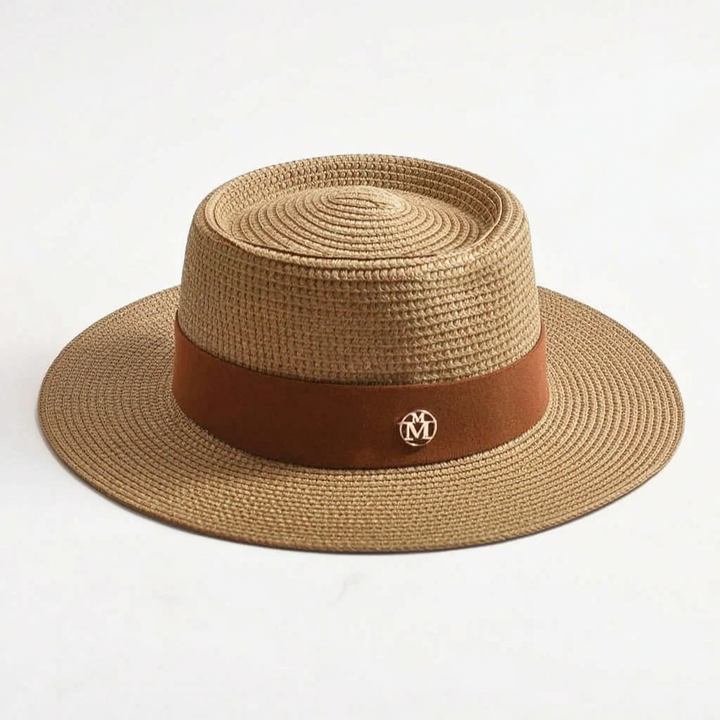 Protective women's sun hat. Flat top, wide brim, woven design for stylish beach trips and summer adventures.