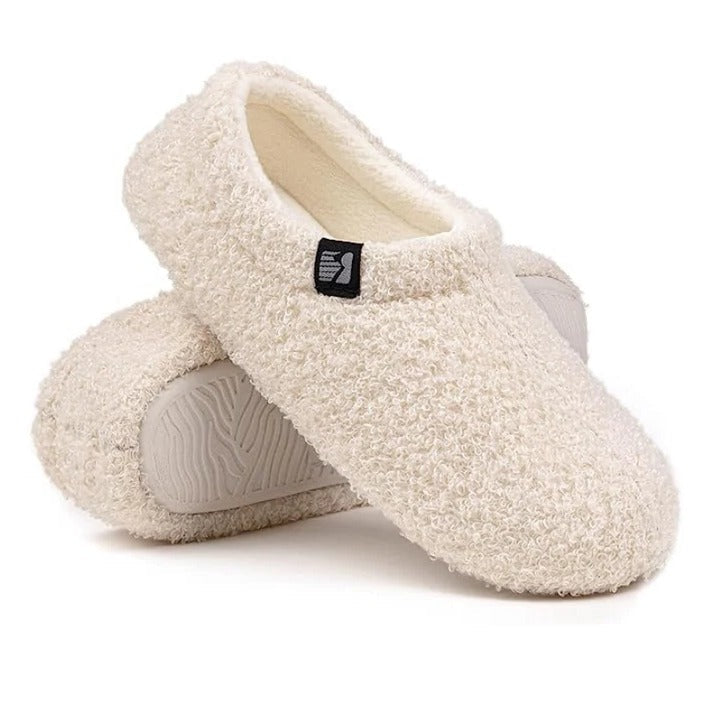 A pair of cozy women's closed back indoor slippers, ready to provide warmth and comfort at home.