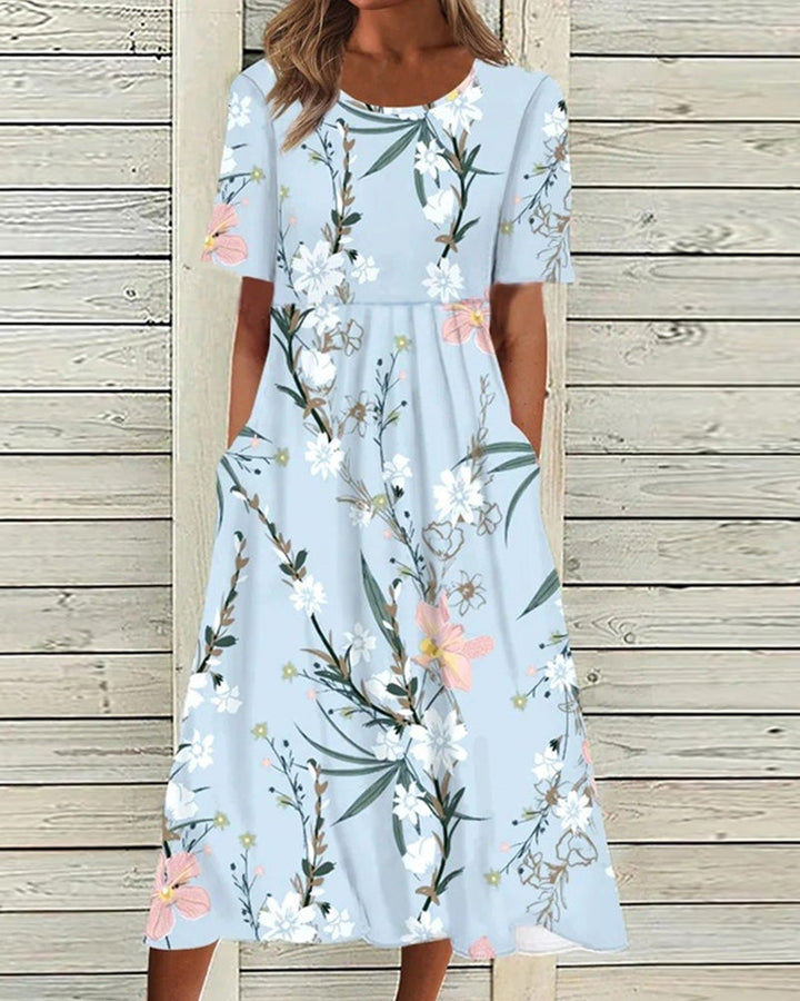 Women's floral A-line midi dress with round neck & short sleeves. Elegant spring & summer casual wear.