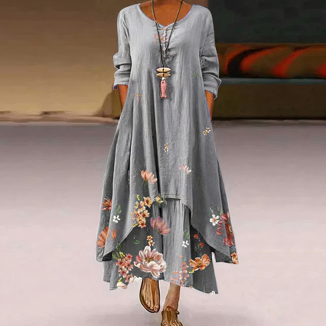 Close-up of intricate floral border print on a women's long sleeve maxi dress fabric, showing quality and detail.