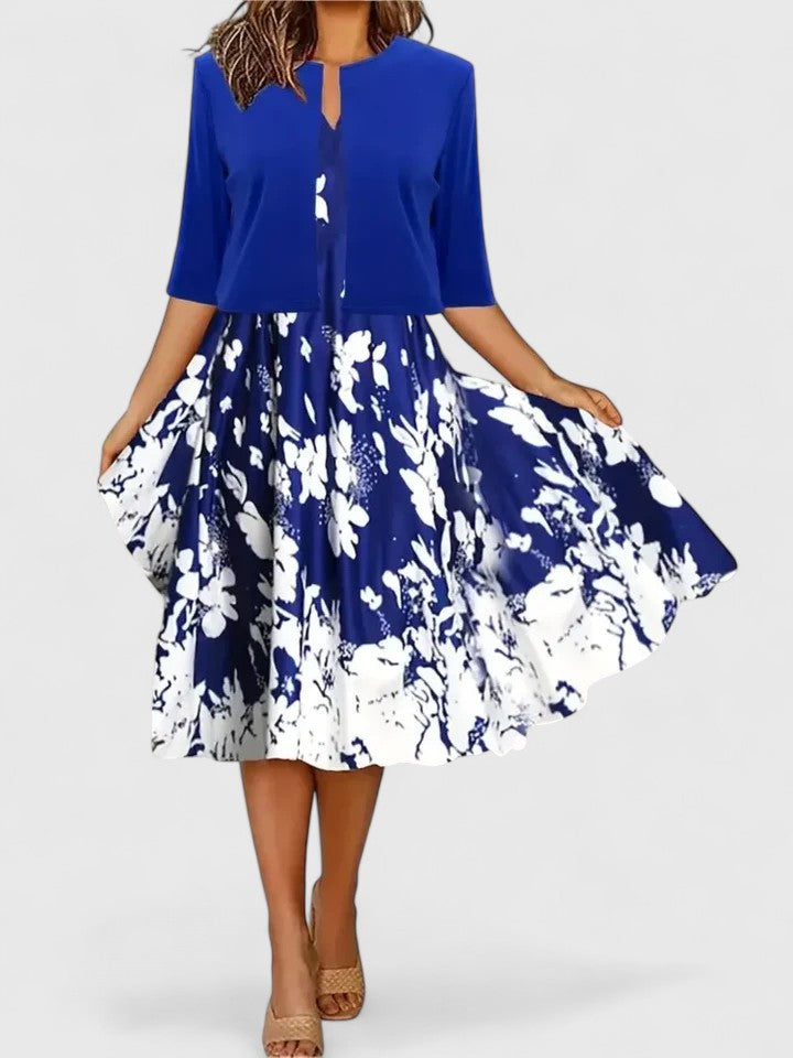Women's elegant floral colorblock A-line midi dress, notch neck, flowy for spring occasions.