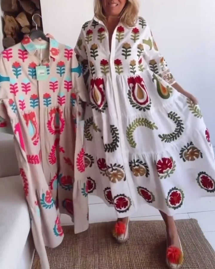 Trendy women's floral graphic midi dress, A-line style, with a distinctive lapel collar. Vacation ready.