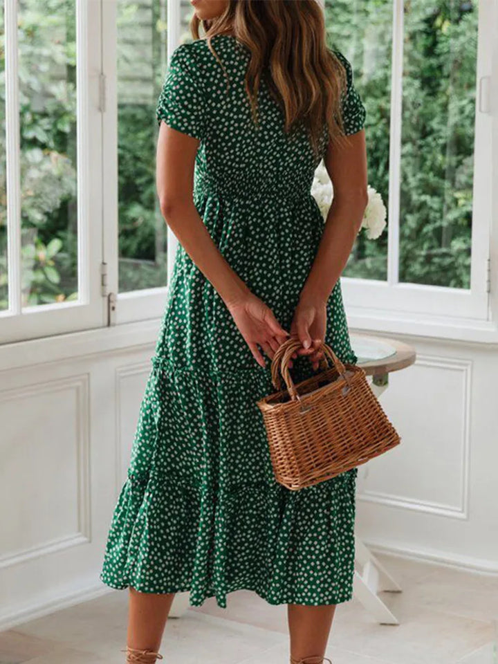 Flowy women's meadow floral maxi dress with smocked bust, puff sleeves. Great for casual summer daytime wear.