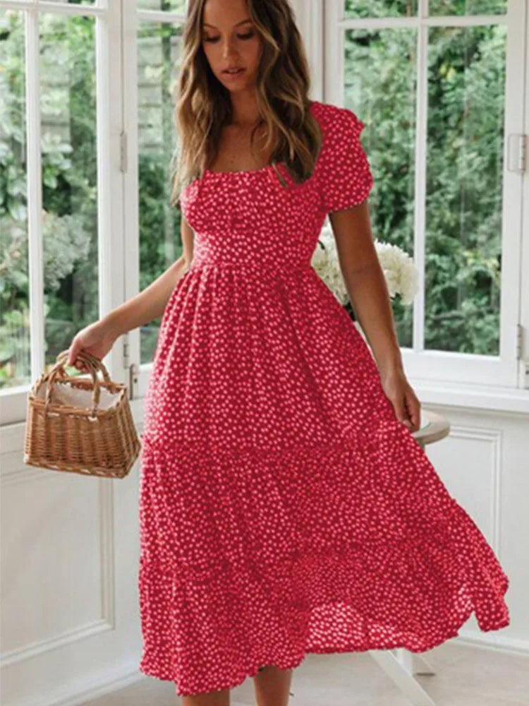 Women's smocked floral maxi dress, vintage style, flowy, puff sleeves. Ideal for summer, beach, or vacation outfits.