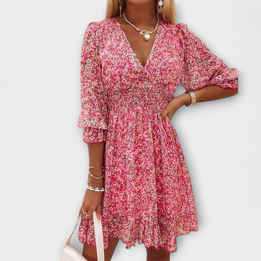 Women's floral midi dress with puff sleeves & A-line silhouette, perfect for summer. Available in pink, green, blue.