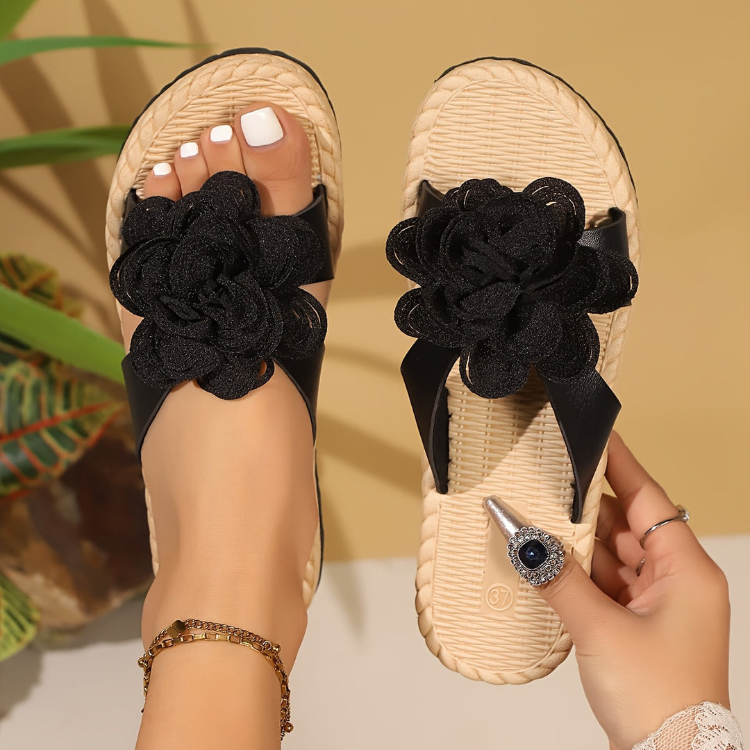 Stylish women's floral pattern sandals with a comfortable low heel. Perfect open-toe footwear for summer outings.