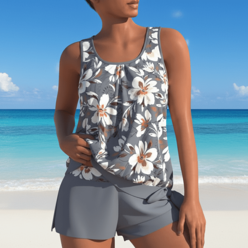 Flattering women's floral two-piece tankini in aqua blue & gray, designed for elegant summer style & comfort.