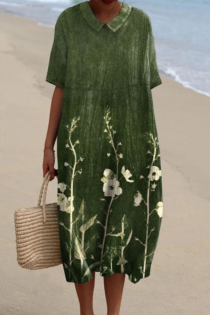 Chic women's floral print midi dress featuring a stylish V-neck. Ideal for summer, casual, or elegant occasions.