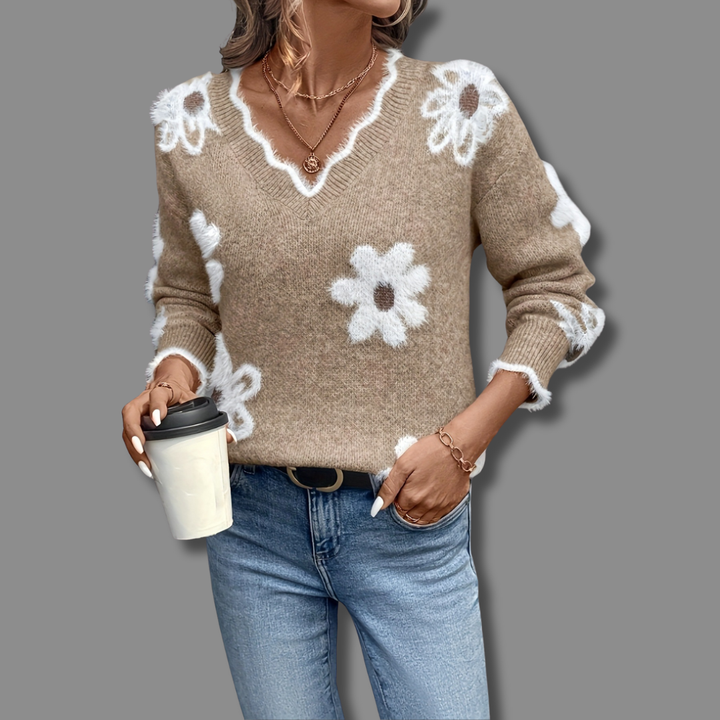 Elegant women's long sleeve V-neck jumper featuring a vibrant floral design and soft textured details.