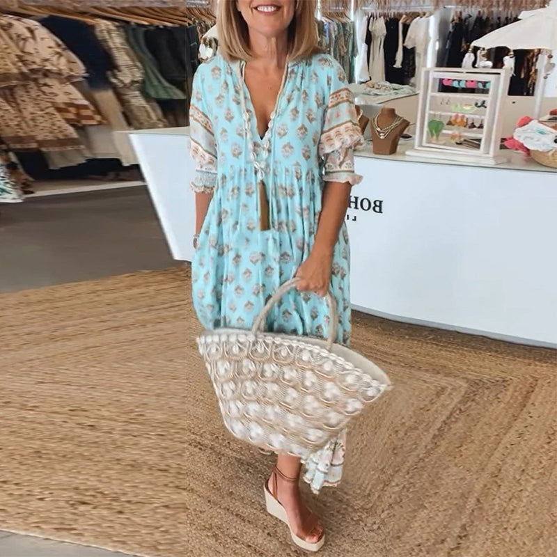 Versatile women's flowy bohemian midi dress, ideal for casual wear, featuring V-neck and pockets.