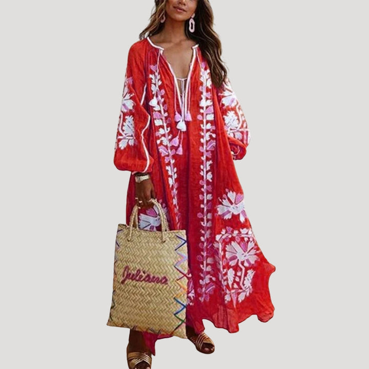 Women's flowy boho maxi dress with V-neck, long sleeves, and a vibrant pattern. Perfect for casual summer wear.