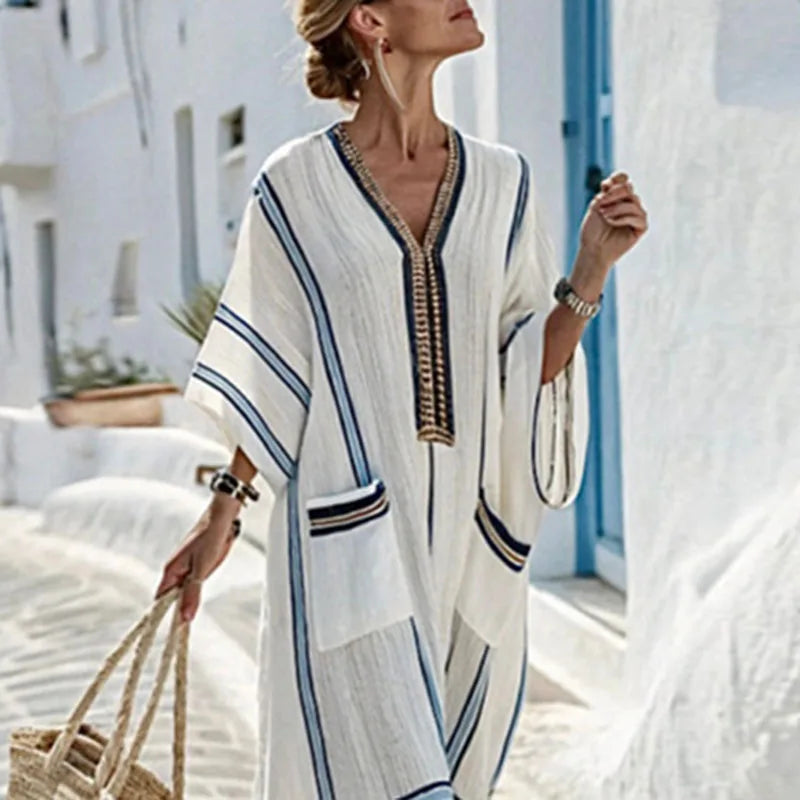 Boho chic V-neck kimono maxi dress for women, featuring convenient pockets. Ideal casual summer and beachwear.