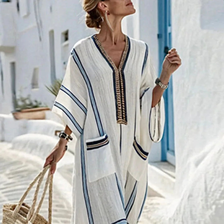 Boho chic V-neck kimono maxi dress for women, featuring convenient pockets. Ideal casual summer and beachwear.