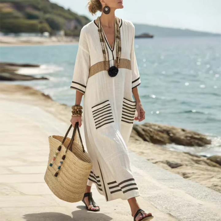 Relaxed women's maxi dress in kimono style with a flattering V-neck & pockets, great for beach days & summer fashion.