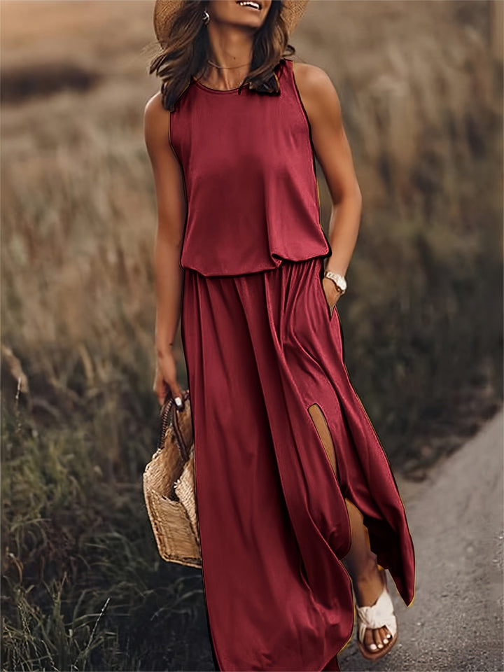 Sleeveless blouson flowy maxi dress for women, with a comfortable elastic waist and fashionable side slit.
