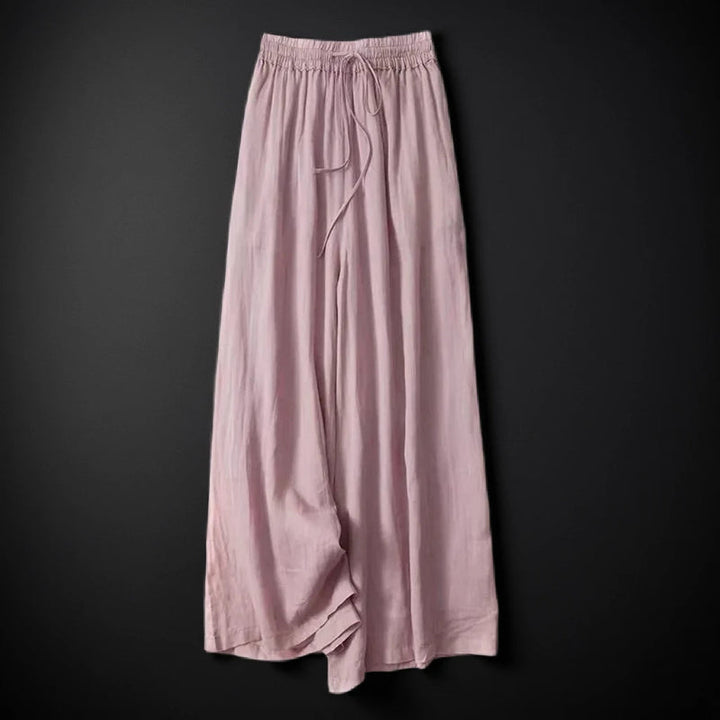 Casual women's flowy wide-leg pants with an adjustable drawstring waist, offering a relaxed and comfy fit.