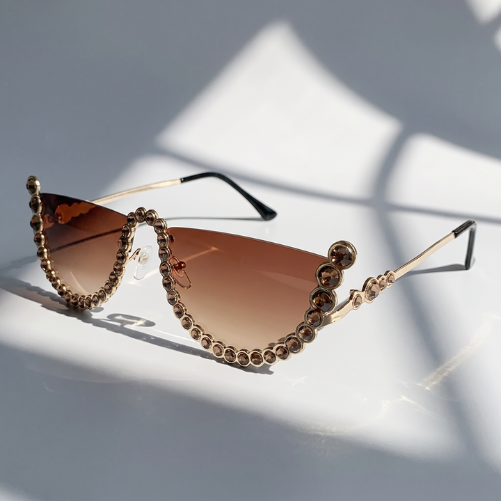 Women's frameless oval sunglasses. Lightweight, chic UV400 eyewear, perfect for outdoor and travel.