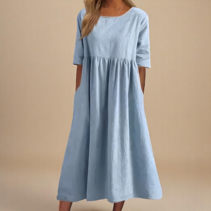 Elegant women's midi dress featuring a gathered waist & half-sleeves, stylish & relaxed fit.