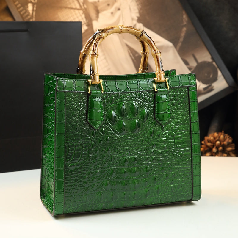 Fashionable women's purse: real leather, embossed crocodile design, and elegant bamboo carry handle.