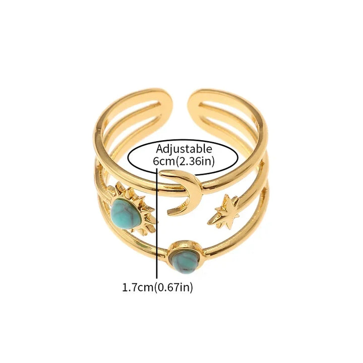 Stunning women's celestial gold finish ring with sun, star, and turquoise. Adjustable & fashionable statement piece.