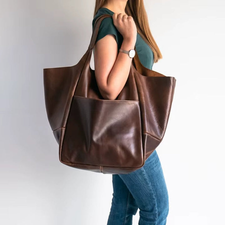 Versatile Women's Grand Carryall Tote, a stylish everyday bag & essential travel accessory.