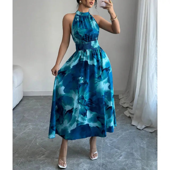 Sleeveless women's halter maxi dress, perfect for parties or vacation. Features a comfortable smocked waist.