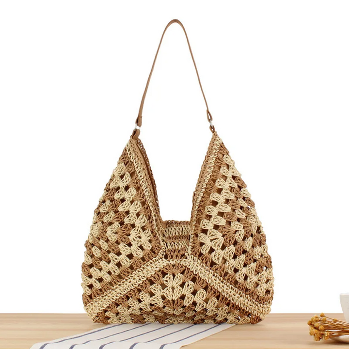 Distinctive women's hand-crocheted boho tote bag, perfect for a unique summer look.