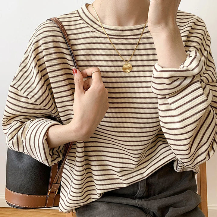 Comfortable women's stripe shirt with relaxed fit. Ideal casual wear top for versatile everyday fashion.