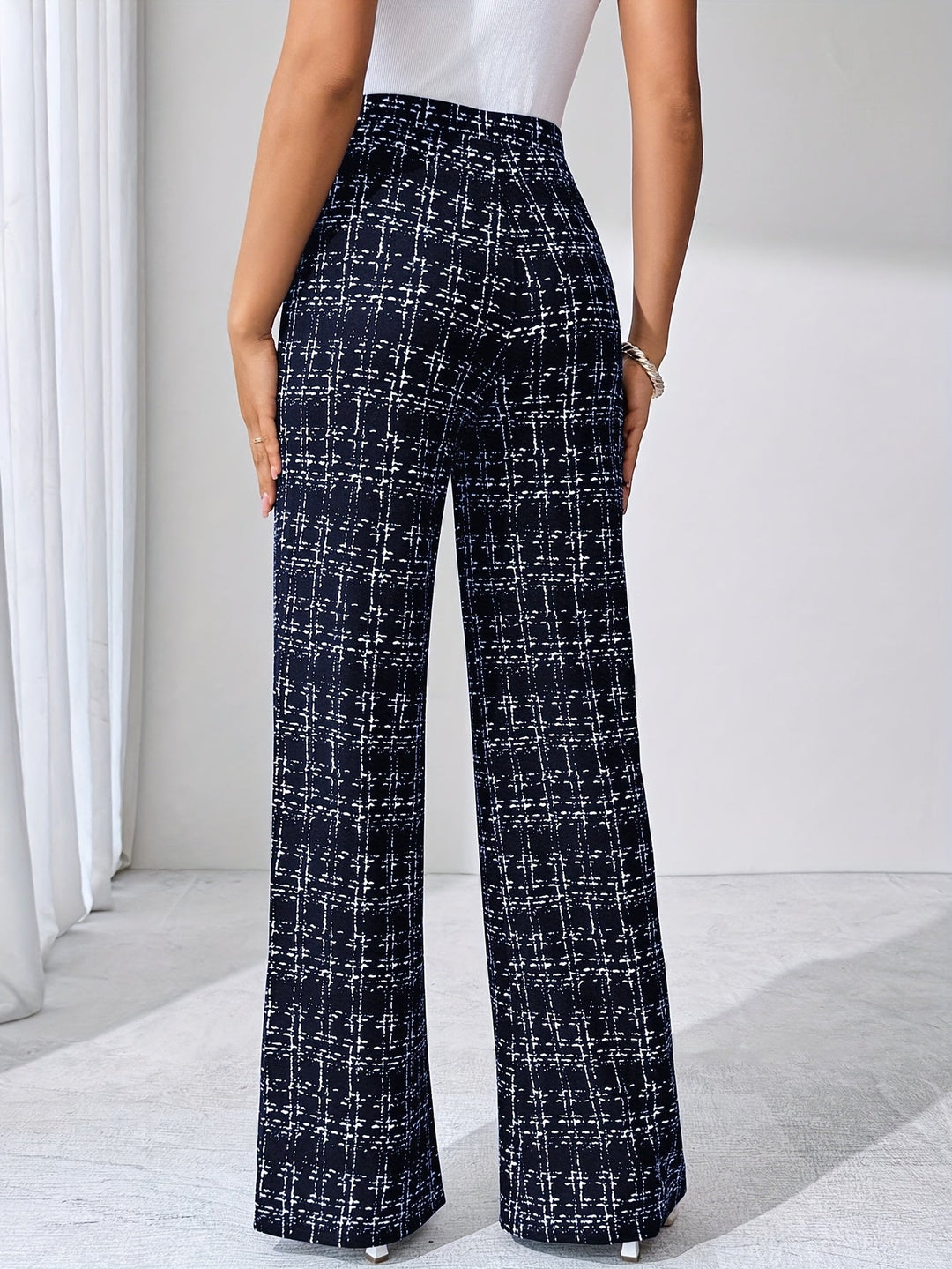 Versatile women's plaid flare pants, high-waisted, stretch knit, with a modern flared leg.