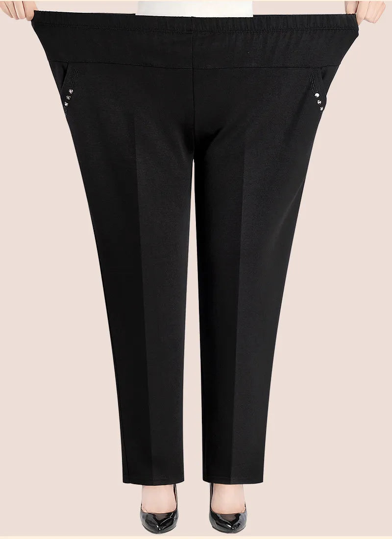 Curvy fit women's high-waisted plus size trousers featuring beautiful floral embroidery.