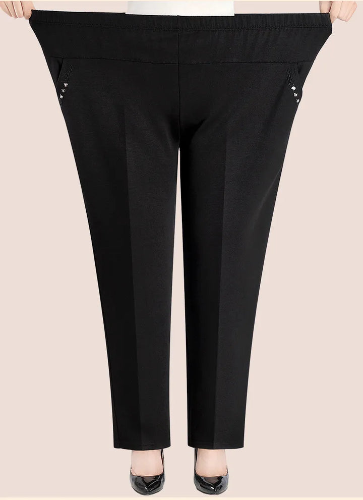 Curvy fit women's high-waisted plus size trousers featuring beautiful floral embroidery.