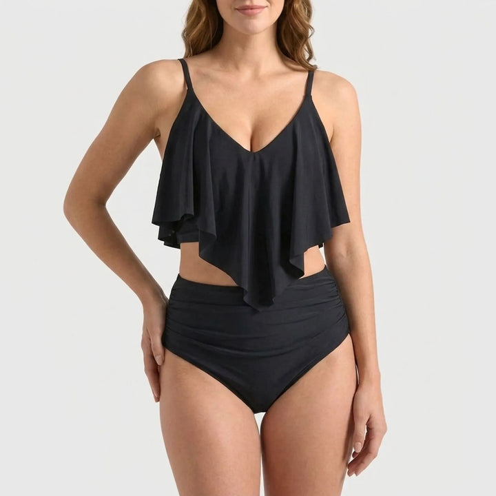Flattering black high-waisted ruffle bikini set. Perfect two-piece swimsuit for summer, beach, and resort wear.