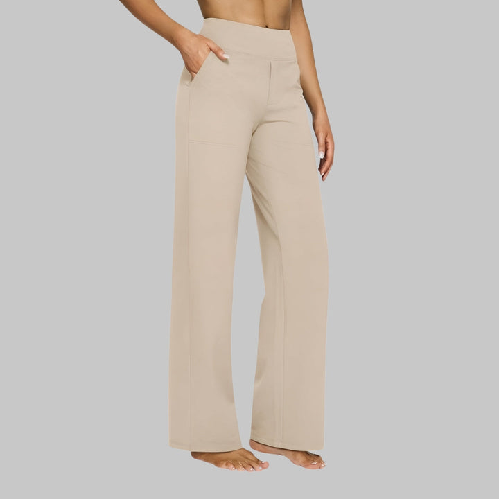 Woman modeling high-waisted wide-leg pants with side pockets, embodying modern casual style.