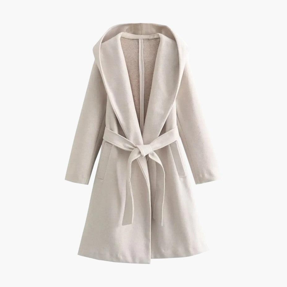 Durable women's trench coat, hooded and belted, providing stylish protection against rain.