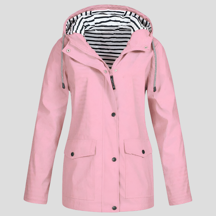 Stylish women's travel jacket. Hooded waterproof windbreaker, lightweight and practical for everyday errands.