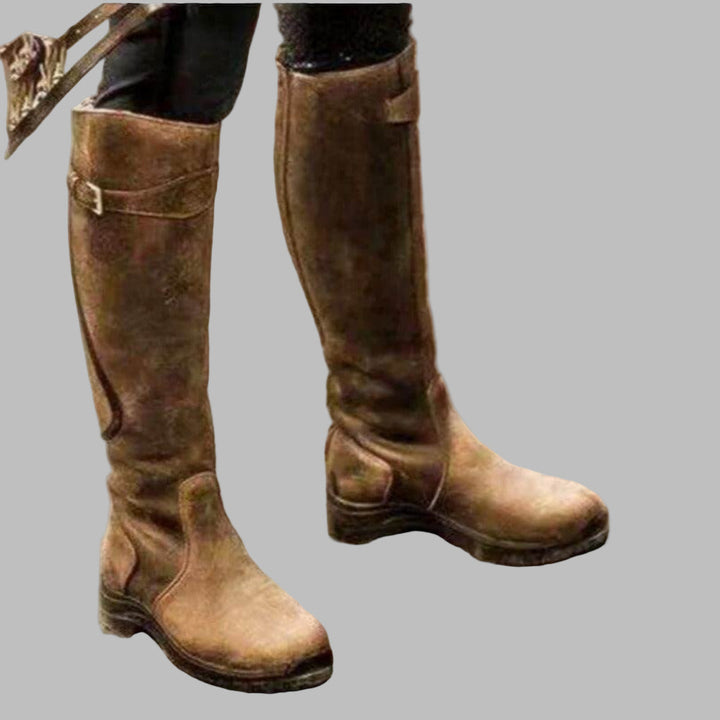 Rugged women's tall knee-high hiking boots featuring buckles for secure outdoor adventures & winter wear.