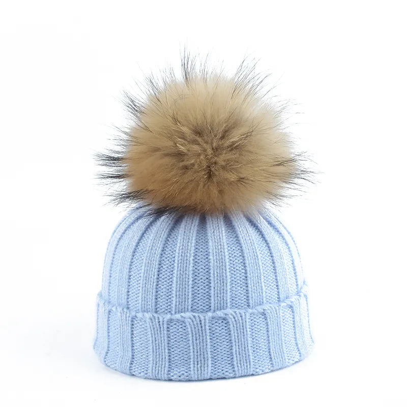Stay warm with this women's knitted winter hat, featuring a charming faux fur pom-pom beanie.