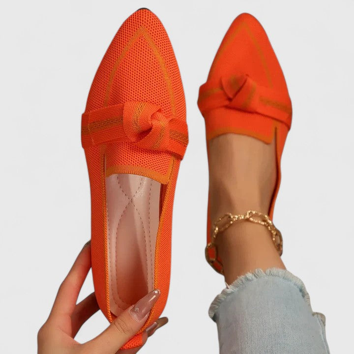 Elegant women's pointed-toe flat loafers featuring a stylish knot-front detail, versatile for any occasion.