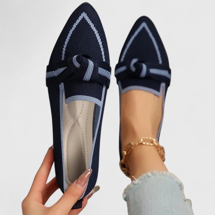 Stylish women's pointed-toe flat loafers with a unique knot-front design, comfortable slip-on footwear.