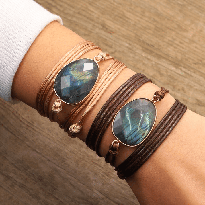 Women's Labradorite rope wrap bracelet with shimmering blue-green flash, perfect for bohemian & spiritual styles.