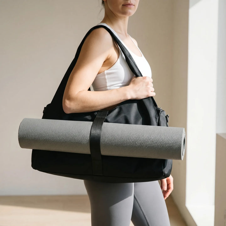 Women's large capacity sports duffel bag for gym, travel & yoga. Spacious workout and fitness accessory.